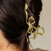 Andi Gold Bow Squiggle Claw Clip